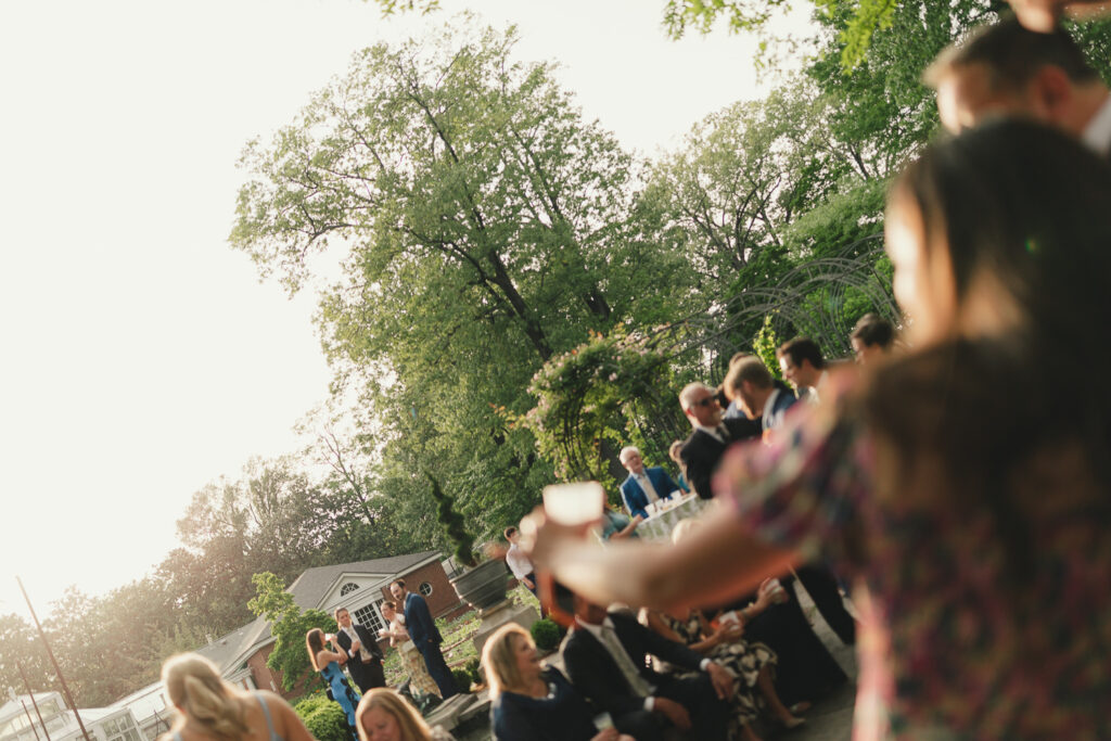 Documentary wedding photography of cocktail hour at garden party wedding in Memphis, TN