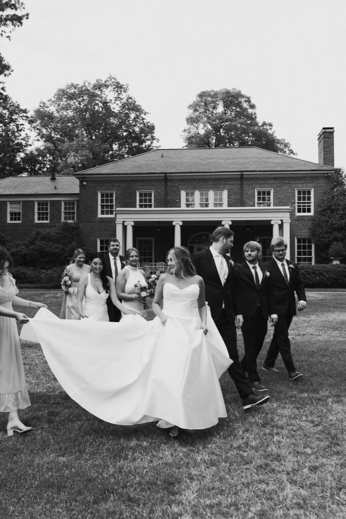 black and white candid wedding party photo at garden wedding in memphis, TN